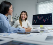 businesswomen discussing stock market data in offi 2025 09 14 06 29 01 utc Why Serious Traders Rely on a Forex VPS for Uninterrupted Automation