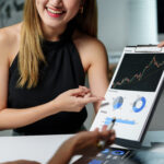 financial advisor showing positive financial chart 2025 09 28 05 13 06 utc 1 High-Frequency Trading for Forex: Why Your VPS Can Make or Break You