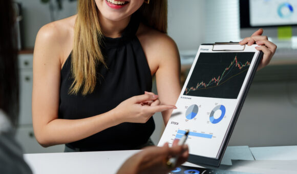 financial advisor showing positive financial chart 2025 09 28 05 13 06 utc 1 High-Frequency Trading for Forex: Why Your VPS Can Make or Break You