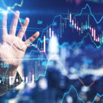 Stock market investment concept with businessman hand touching digital screen with forex chart indicators