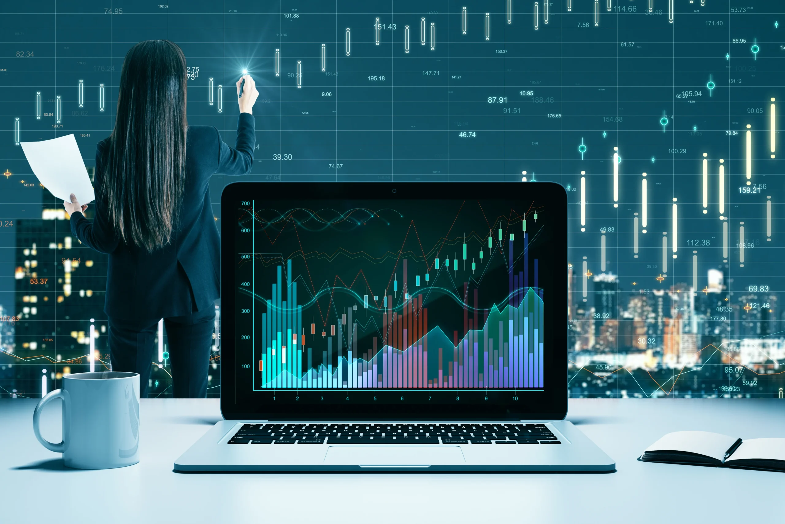 An adult with long dark hair analyzes data on a laptop. The woman is seen from the back, and wears a business suit. She holds a pen to the transparent display, seemingly annotating the data shown.