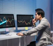 stock-trader-analyzing-charts-on-computer-screens