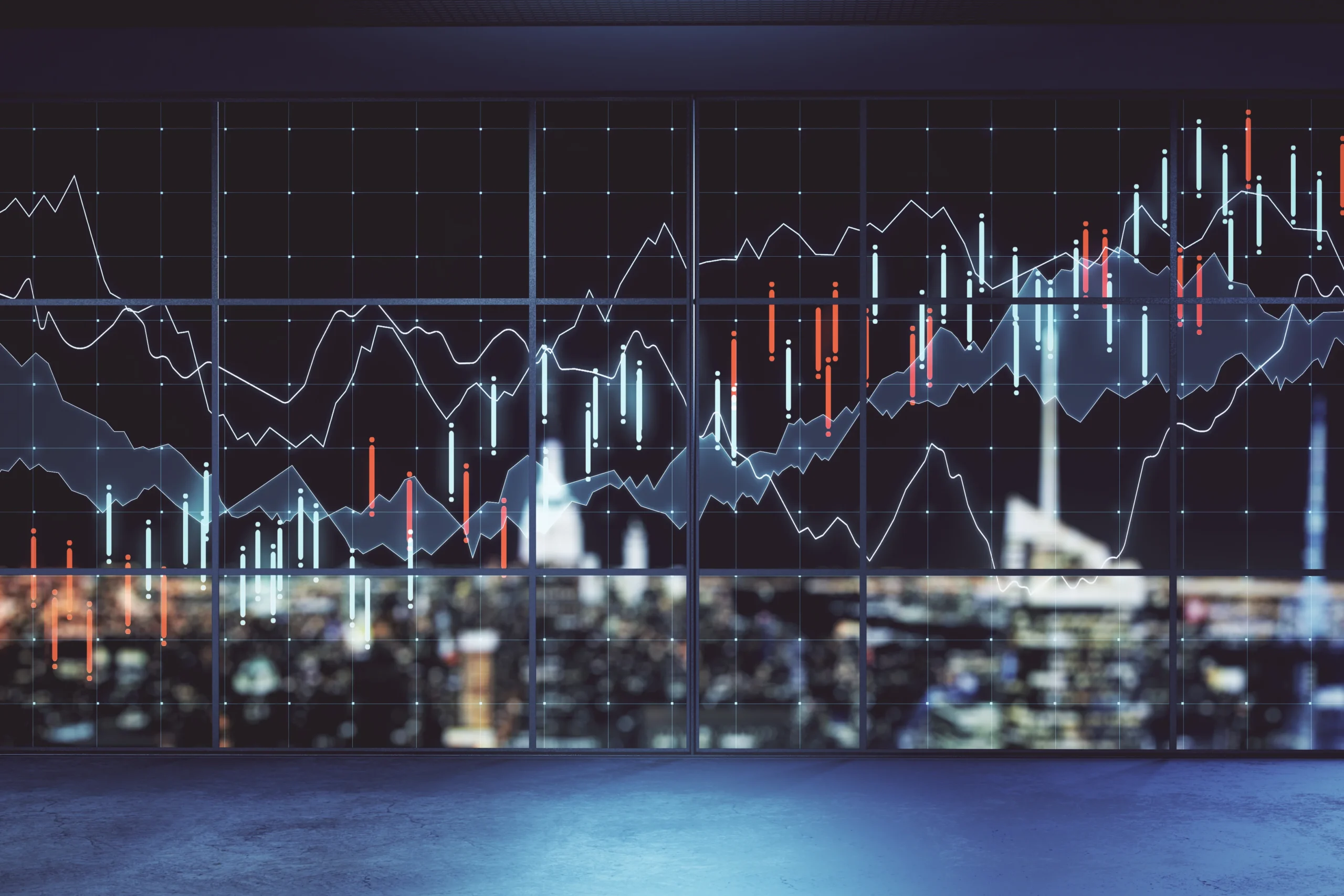 Imagery shows financial stock market charts overlaid onto a large window. Through the window a city skyline is visible at night. Graph lines illustrate the rise and fall of data. The blue and orange graphs on the window and the blurred city lights in the background.