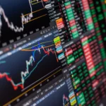 Detailed-view-of-stock-market-charts-and-data-on-a-monitor-showcasing-market-trends