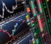 Detailed-view-of-stock-market-charts-and-data-on-a-monitor-showcasing-market-trends