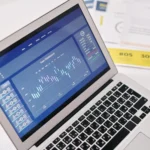 pen-laptop-displaying-financial-graphs-and-analytics-for-forex-trading