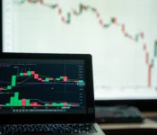 Close-up-of-a-laptop-showing-cryptocurrency-market-charts-in-a-trading-environmen